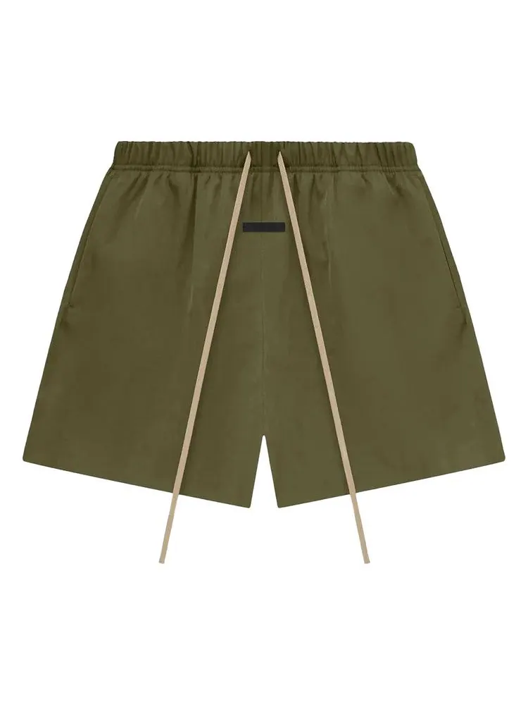 Шорты Fear of God Essentials Textured Nylon Soccer Short — изображение 1 из 2, оливковый
