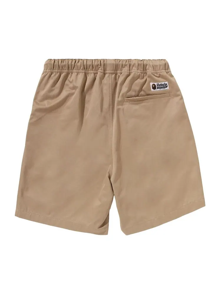 Шорты BAPE Ape Head One Point 2 Pleat Easy Chino Shorts — изображение 2 из 3, бежевый