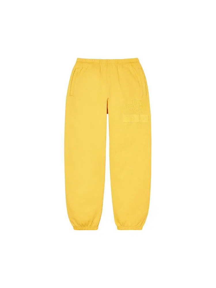 Спортивные брюки Supreme x The North Face Pigment Printed Sweatpant — изображение 1 из 2, желтый