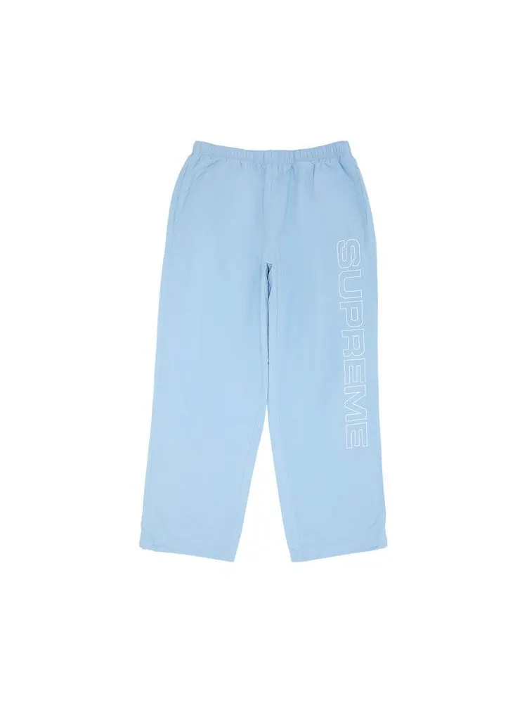 Брюки Supreme Spellout Embroidered Ripstop Track Pant