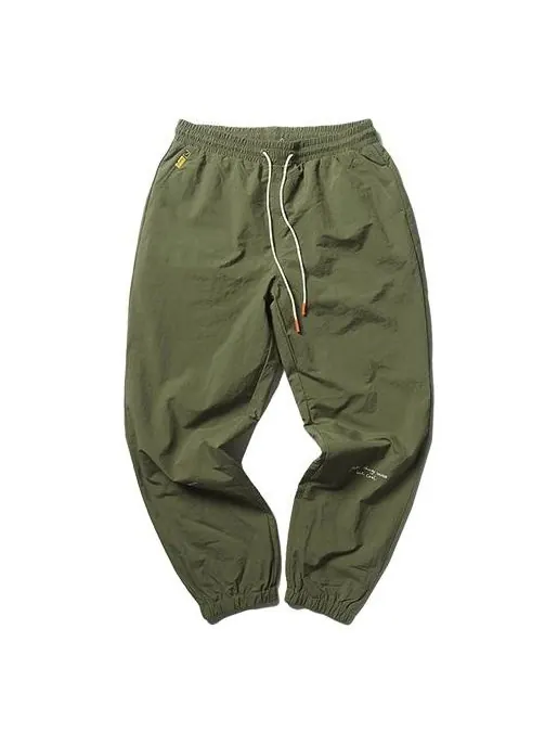 Брюки x randomevent woven pants 'green' Puma — изображение 1 из 4, зеленый