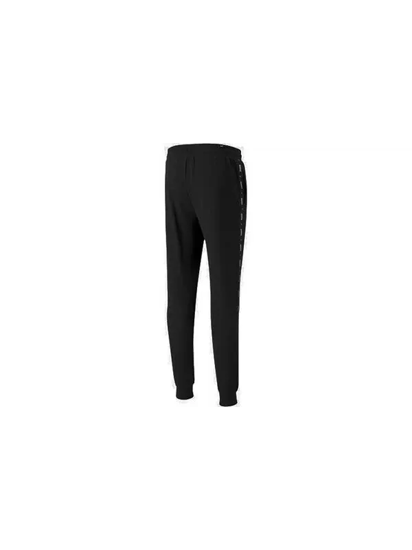Брюки ess+ tape sweatpants 'black' Puma — изображение 2 из 4, черный
