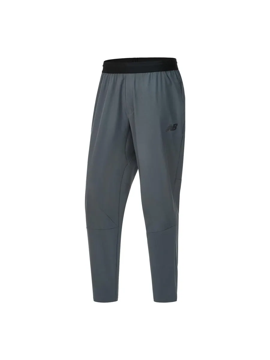 Спортивные брюки New Balance RWTech Stretch Woven Pants 'Lead' — изображение 1 из 1, серый