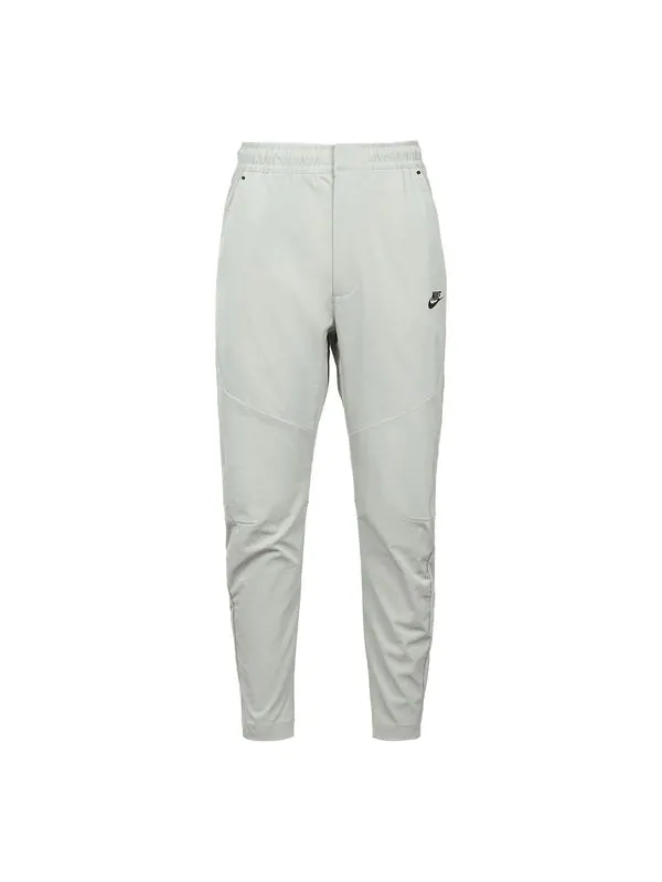 Повседневные брюки tech commuter casual без подкладки спортивные длинные брюки mineral grey Nike — изображение 1 из 2