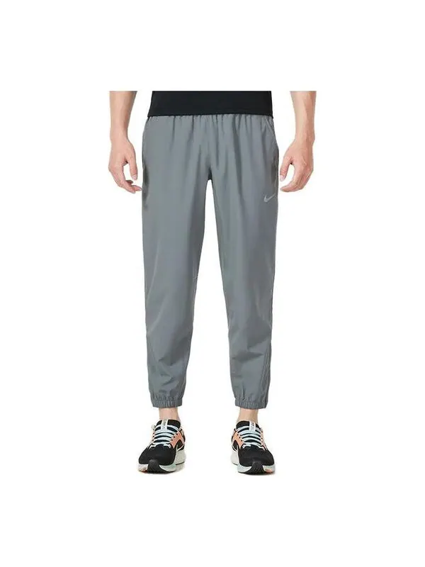 Брюки от dri fit зауженные универсальные брюки Nike — изображение 1 из 3, серый