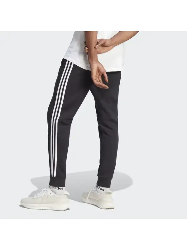 Брюки Essentials флисовые 3 полоски зауженные манжеты джоггеры Adidas — изображение 4 из 4, черный/белый