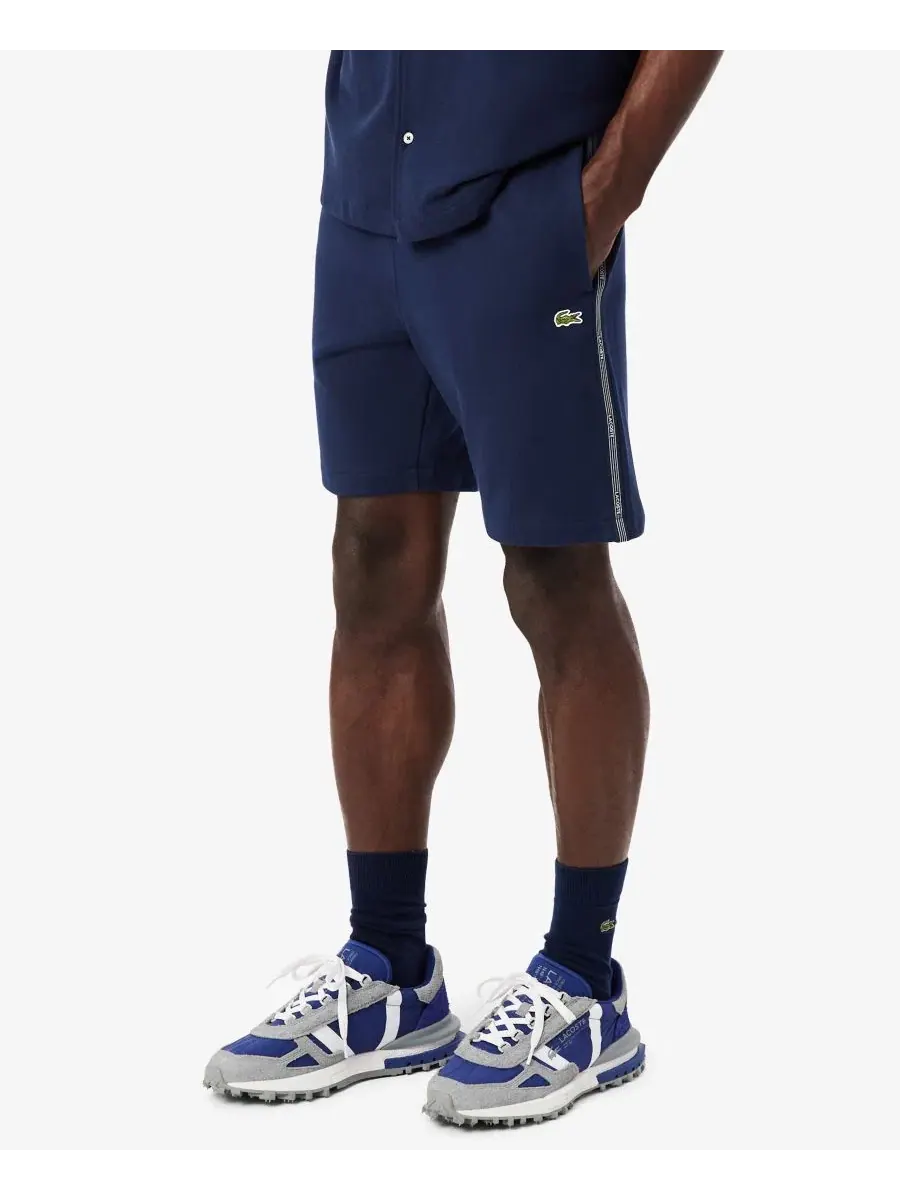 Шорты Lacoste мужские флисовые прямые с логотипом и полосками — изображение 1 из 4, темно-синий