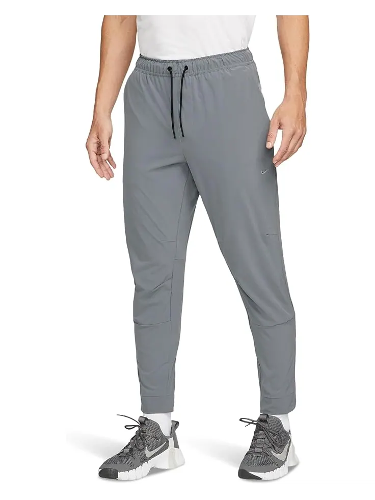 Брюки Nike Dri-FIT Unlimited Tapered Pants — изображение 1 из 3, серый/черный/серый