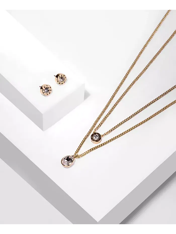 Серьги-гвоздики с кристаллами и логотипом DKNY — изображение 4 из 4, оттенок золото
