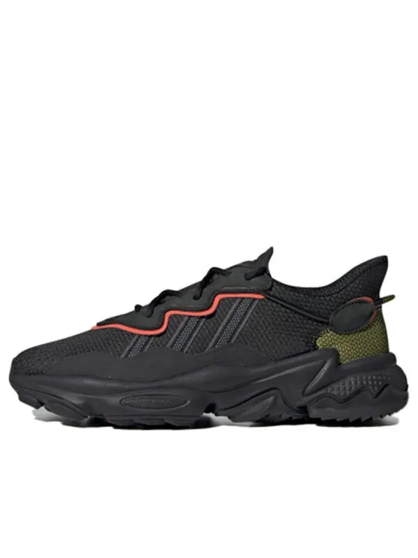 Кроссовки ozweego tr Adidas — изображение 1 из 4, черный/оранжевый