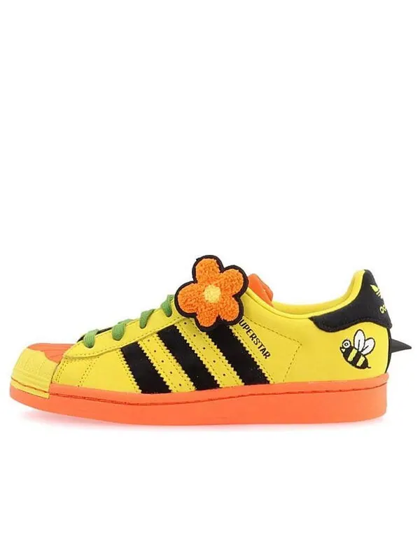 Кроссовки тающая грусть x суперзвезда Adidas — изображение 1 из 4, черный/желтый/оранжевый